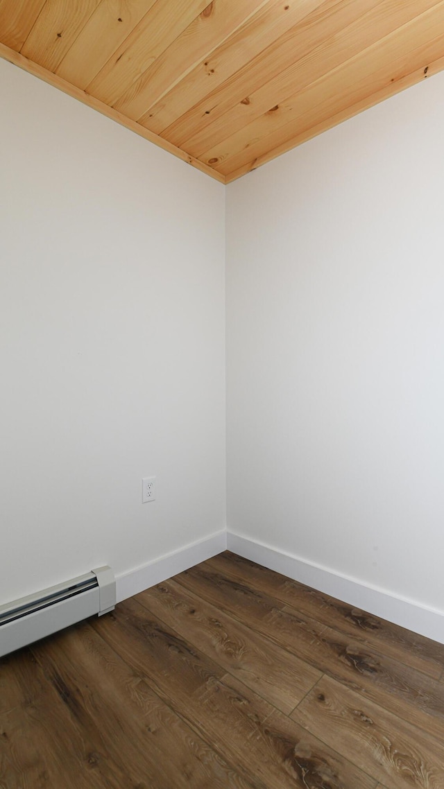 48 Harmony Row, Bethel, ME 04217 - spare room featuring a baseboard radiator and dark wood-style flooring