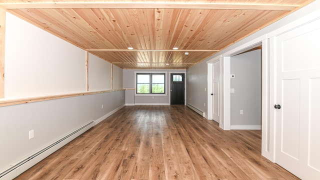 48 Harmony Row, Bethel, ME 04217 - spare room featuring a baseboard heating unit, wooden ceiling, and light wood-type flooring