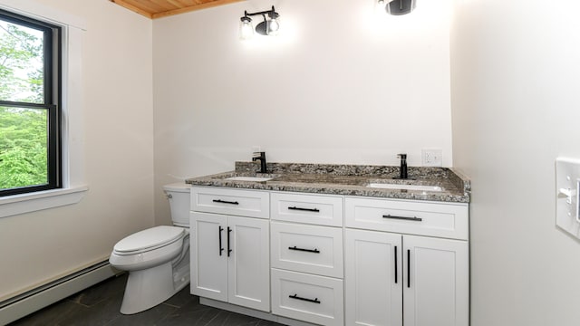 48 Harmony Row, Bethel, ME 04217 - bathroom featuring a baseboard heating unit and double vanity
