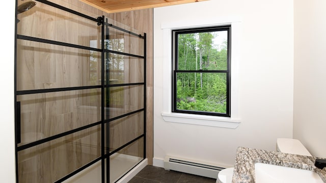 48 Harmony Row, Bethel, ME 04217 - full bath featuring a baseboard heating unit, tiled shower, and tile patterned floors