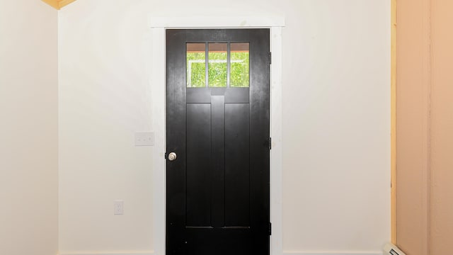 48 Harmony Row, Bethel, ME 04217 - property entrance with baseboard heating