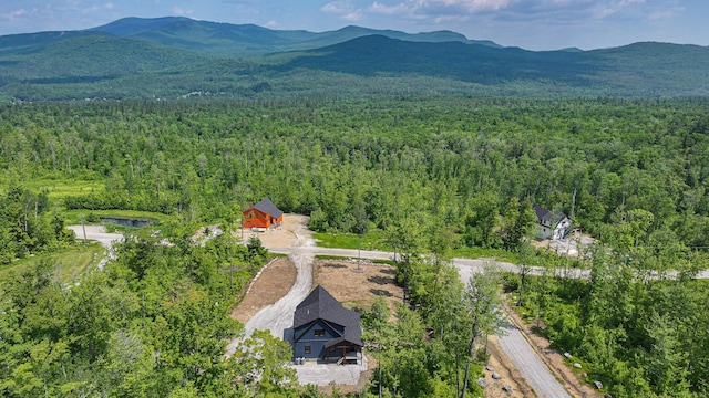 48 Harmony Row, Bethel, ME 04217 - aerial view of property's location featuring a heavily wooded area and a mountainous background