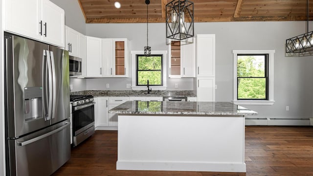 48 Harmony Row, Bethel, ME 04217 - kitchen featuring stainless steel appliances, baseboard heating, wood ceiling, stone countertops, and dark wood finished floors