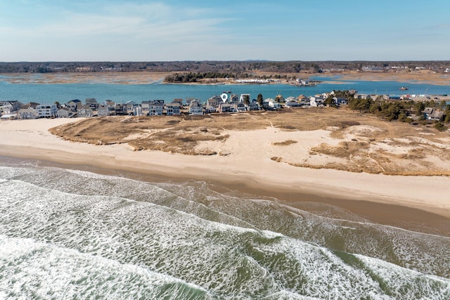 exterior space featuring a water view and a view of the beach