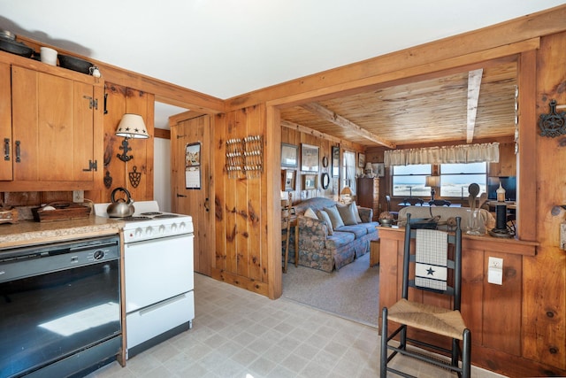 kitchen featuring dishwasher, white range with gas cooktop, wooden walls, wood ceiling, and light carpet