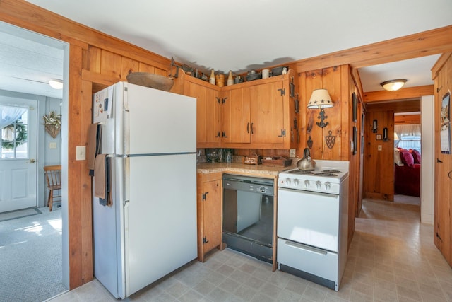 kitchen with light carpet and white appliances