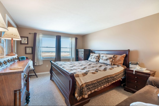 bedroom featuring light colored carpet