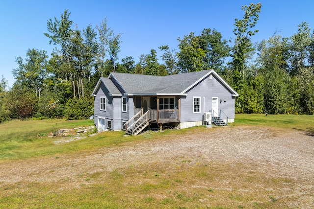 view of front of house with a porch and a front lawn