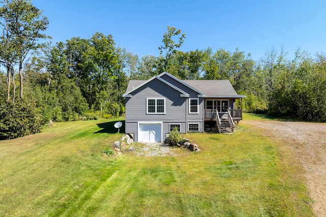 view of front facade with a garage and a front lawn