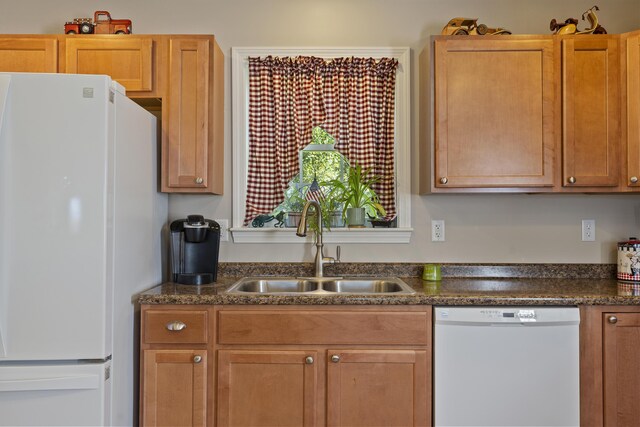 kitchen with white appliances and sink