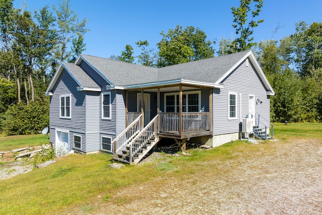 view of front facade with a porch and a front lawn