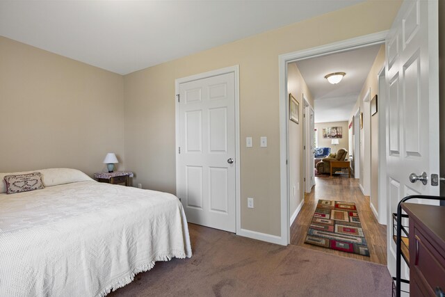 bedroom with wood-type flooring