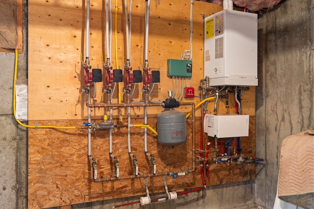 utility room featuring tankless water heater