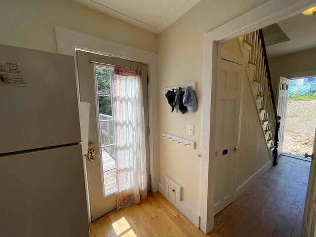 entryway with light hardwood / wood-style flooring