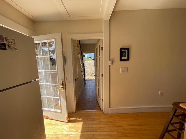 hall with light hardwood / wood-style floors