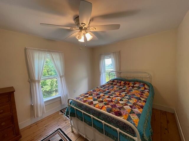 bedroom featuring ceiling fan and light hardwood / wood-style floors