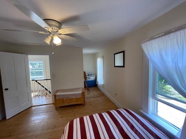 unfurnished bedroom featuring ceiling fan and hardwood / wood-style flooring