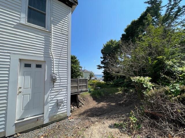 view of side of property featuring a deck