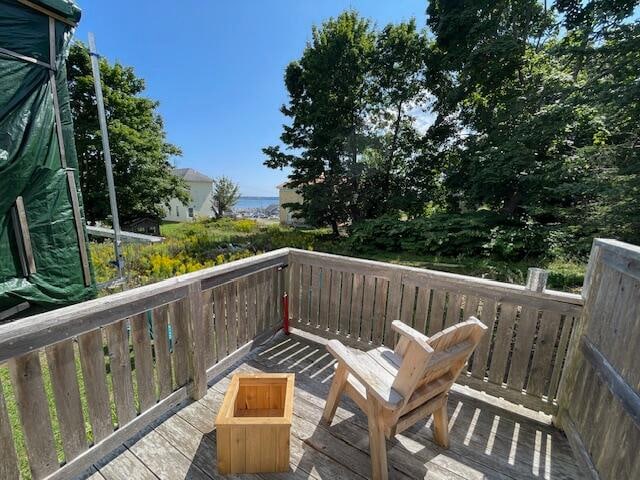 wooden deck with a water view