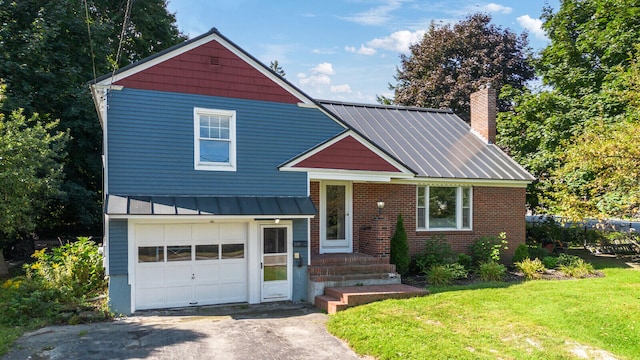 view of front facade featuring a front yard and a garage