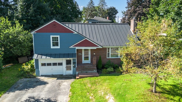 view of front facade with a front lawn and a garage