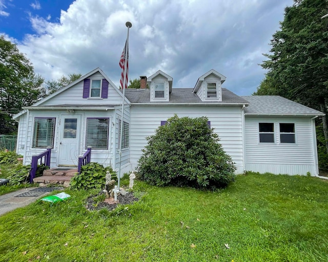 139 Lake Rd, Robbinston, ME 04671 - view of front of house with a front yard and roof with shingles