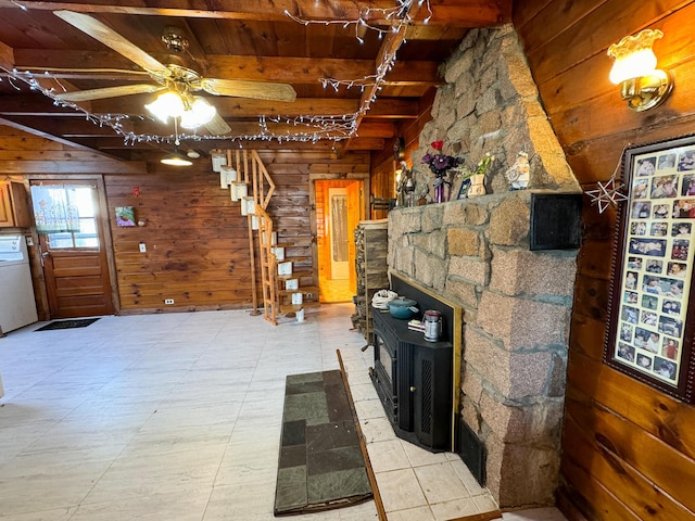 139 Lake Rd, Robbinston, ME 04671 - unfurnished living room featuring wooden walls, wooden ceiling, beam ceiling, ceiling fan, and washer / clothes dryer
