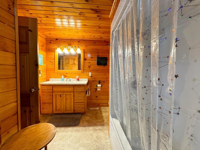 139 Lake Rd, Robbinston, ME 04671 - full bath with wooden walls, vanity, shower / bath combo with shower curtain, and wood ceiling