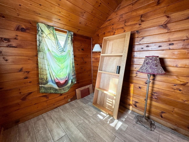 139 Lake Rd, Robbinston, ME 04671 - mudroom featuring lofted ceiling, wood-type flooring, and wooden walls