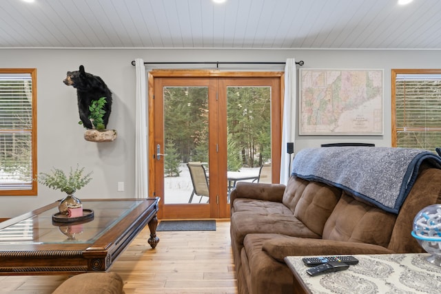 living room with wood ceiling and light wood-type flooring