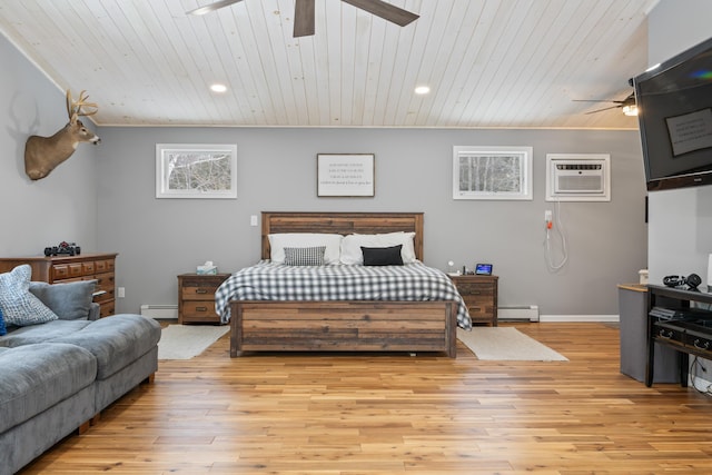 bedroom featuring a baseboard heating unit, wooden ceiling, a wall unit AC, and light wood-type flooring