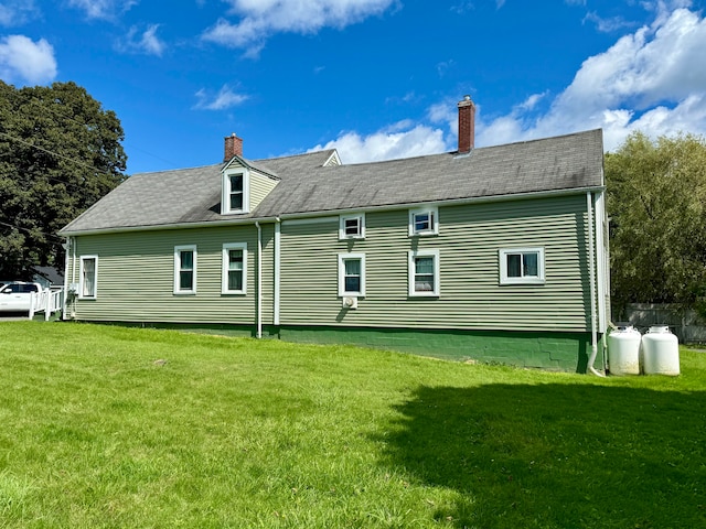 back of house with a yard