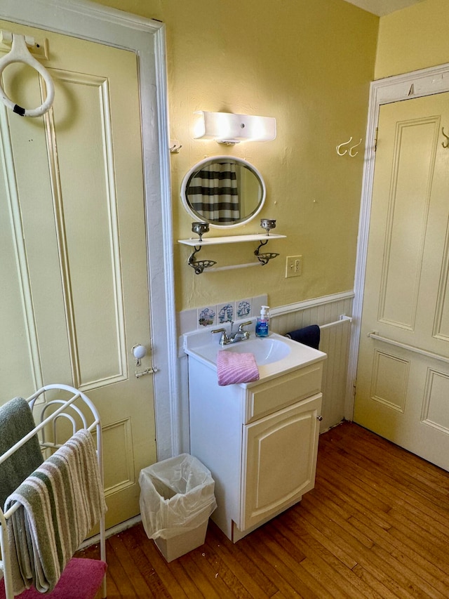 bathroom with vanity and hardwood / wood-style flooring