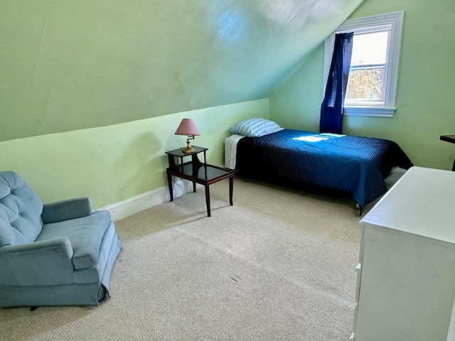 carpeted bedroom featuring lofted ceiling