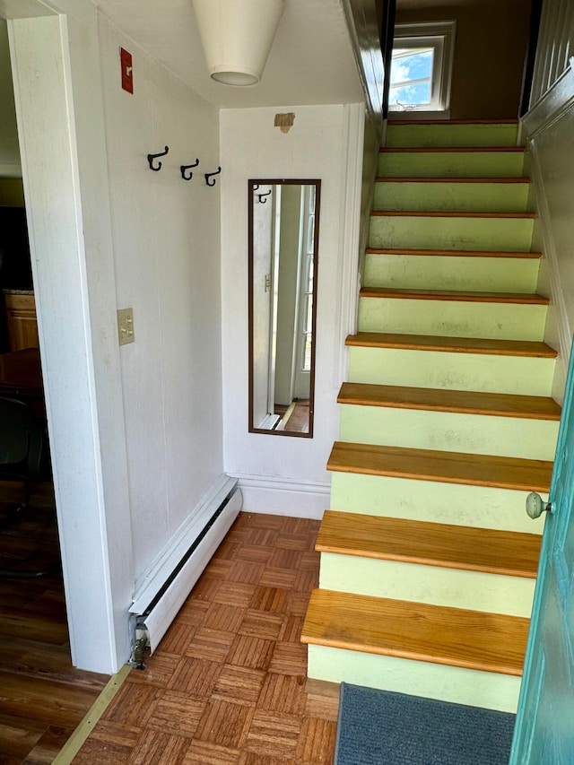 stairway with a baseboard heating unit