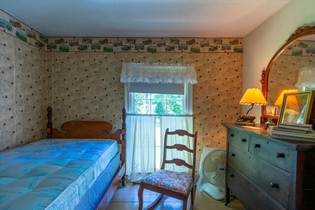 bedroom featuring light tile patterned flooring