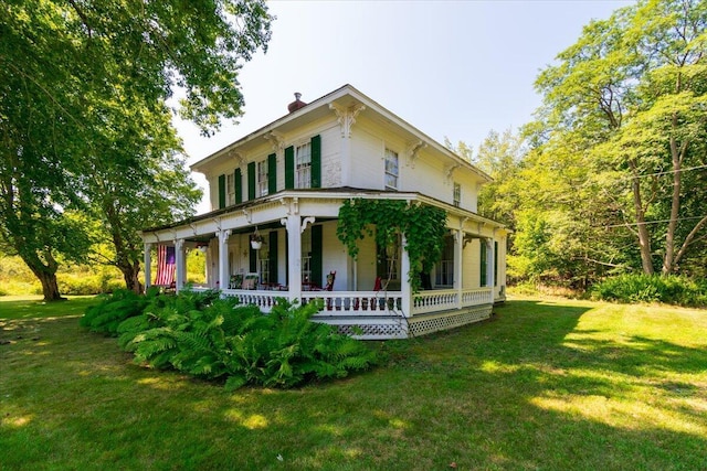 292300 Main Rd, Islesboro, ME 04848 - exterior space with a chimney, a porch, and a lawn