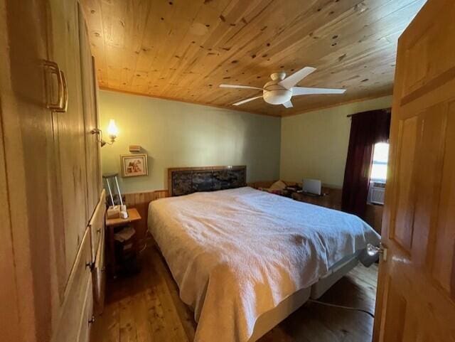 bedroom with wood ceiling, wood-type flooring, and ceiling fan