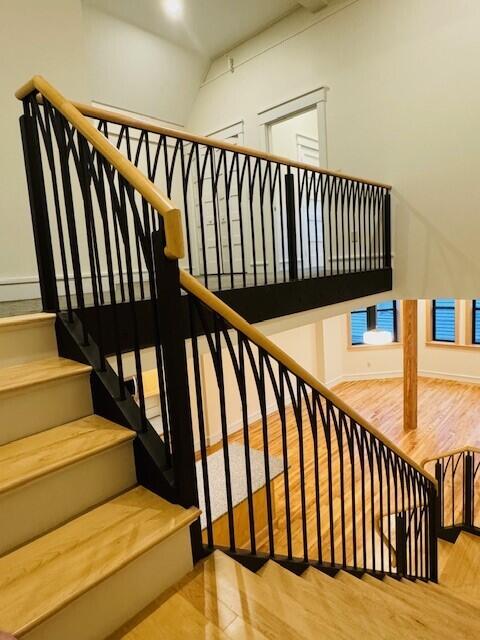 stairway featuring hardwood / wood-style floors