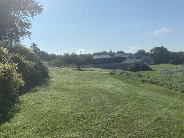 view of yard with a rural view