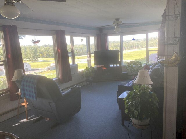 living room featuring ceiling fan and carpet floors