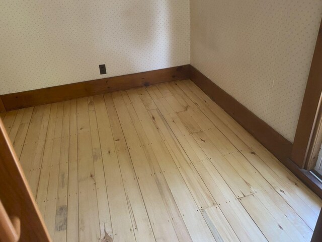 unfurnished room featuring light hardwood / wood-style flooring