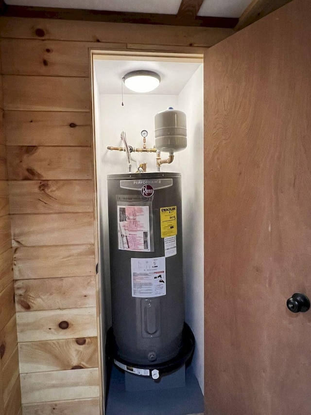 utility room with electric water heater