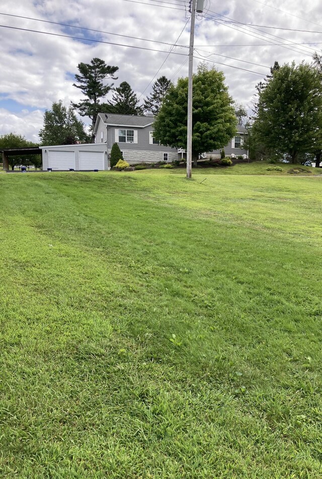 view of yard with a garage