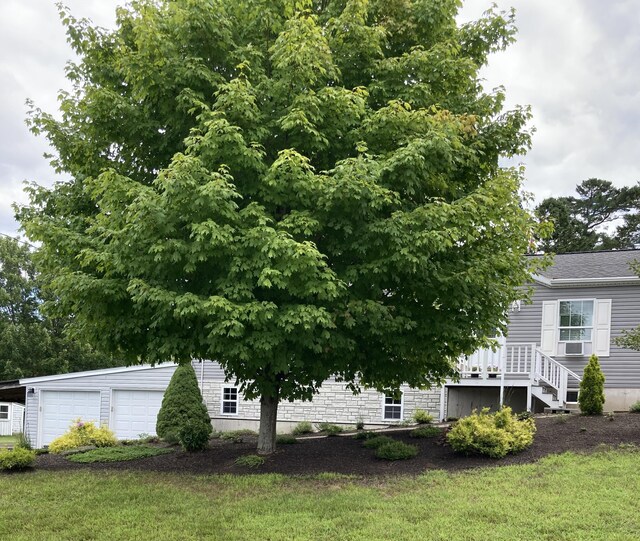 exterior space featuring a yard and a garage