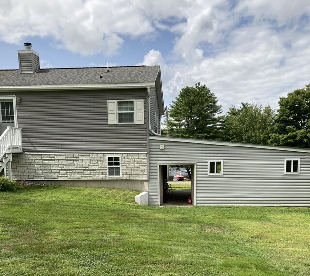 back of house featuring a yard