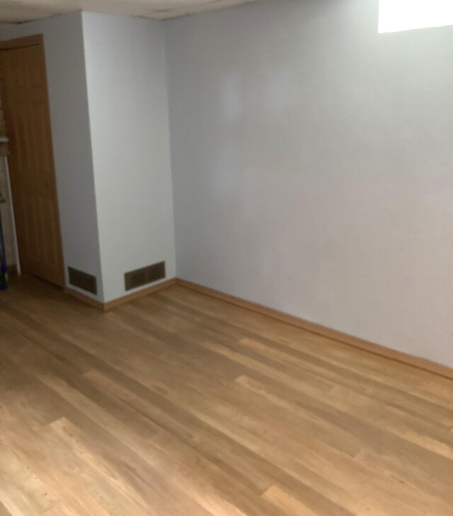 unfurnished room featuring light hardwood / wood-style flooring