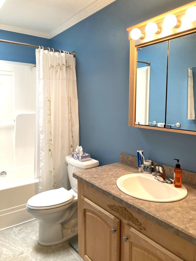 full bathroom with crown molding, vanity, tile patterned floors, toilet, and shower / bath combo with shower curtain