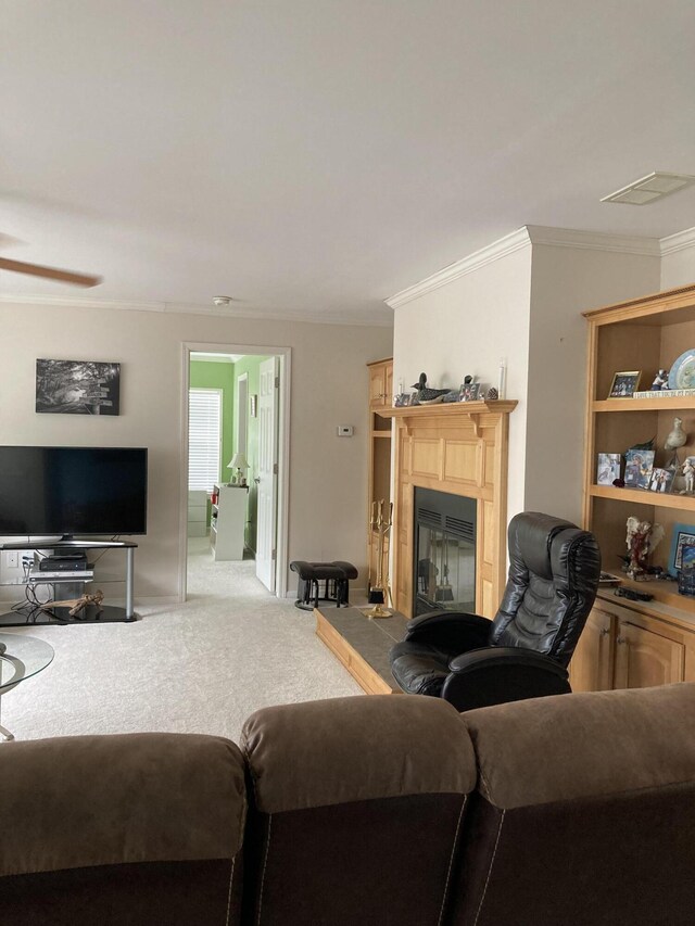 living room with light colored carpet and ornamental molding