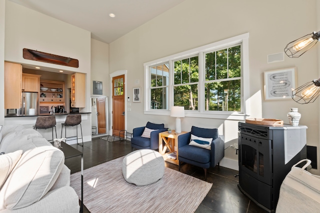 living room featuring a towering ceiling